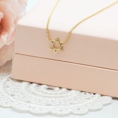 "Delicate Magen David Charm gold necklace, A Star of David necklace, a symbol of Jewish faith and heritage, a beautiful piece of Israeli Jewelry. This meaningful Magen David pendant necklace represents the enduring strength and spirit of the Jewish people. The 'Magen David' is an iconic symbol of Judaism, signifying its significance and unity. This necklace is not only a stunning piece of jewelry but also a timeless gift that holds deep meaning for those you cherish. MAGEN DAVID CHARM NECKLACE ✧ DETAILS: ✦ 14k white/yellow/rose gold. Please select your preferred choice from the drop-down menu, when ordering. ✦ The charm pendant measures 7 mm (0.26\") in diameter. ✦ The charm is 0.75 mm (0.03\" ) in thickness.  ✦ Length options :  ✧ 14 inches necklace  ✧ 16 inches chain necklace  ✧ 18 inche Formal Gold Necklace With Star Charm, Star Of David Tarnish Resistant Necklace Gift, Gold Star Necklace For Anniversary, Yellow Gold Star Necklace Gift, 14k Gold Star Necklace For Gift, 14k Gold Star Necklace As Gift, 14k Gold Star Necklace Perfect For Gifts, Spiritual Yellow Gold Necklace With Star Charm, Luxury Star Of David Necklace With Star Charm