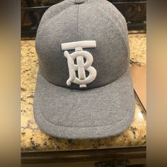 *New* Men’s Authentic Burberry Cap Tb Monogram Motif Jersey Cap Dark Charcoal All Tags Attached. *Never Worn-New* Classic Hat With Logo And Curved Brim, Classic Hat With Curved Brim And Logo Detail, Classic Hat With Logo Detail And Curved Brim, Luxury Hats With Logo Patch And Curved Brim, Designer Snapback Baseball Cap With Embroidered Logo, Luxury Baseball Cap With Embroidered Logo And Flat Brim, Classic Cap With Logo Detail, Luxury Flat Brim Baseball Cap With Embroidered Logo, Luxury Curved Brim Baseball Cap