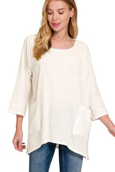 Add a touch of boho to your wardrobe with this Zenana Pullover Top. Made with breathable cotton gauze, this top features a scoop neck and 3/4 sleeves. The generous fit and two front patch pockets make this top both comfortable and fashionable. Available in 7 colors. Approx Measurments: Small Bust 48" Front Length 27" Med Bust 50" Front Length 28" Large Bust 52" Front Length 29" X-Large Bust 54" Front Length 30" Beige Relaxed Fit Blouse For Layering, White Cotton Lagenlook Blouse, Spring Beige Cotton Tunic, Flowy Cotton Blouse In Beige, Beige Cotton Tunic For Spring, Flowy Beige Cotton Blouse, Bohemian Cotton Blouse For Layering, Beige Long Sleeve Cotton Tunic, Long Sleeve Cotton Tunic In Beige