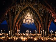 an image of a chandelier in the middle of a room with candles on it