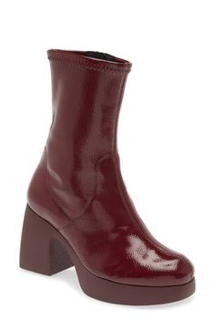 Glossy patent leather amplifies the retro glamour of a block-heel platform bootie grounded by comfort-enhancing memory gel cushioning. 3 1/4" heel; 1" platform 8" shaft Memory gel cushioning Leather upper and lining/synthetic sole Made in Spain Chunky Red Boots, Burgundy Docs Outfit, Burgundy Platform Boots, Red Brown Boots, Cute Boots Aesthetic, 70s Shoes Women, 70s Style Shoes, Cherry Boots, Dark Red Shoes