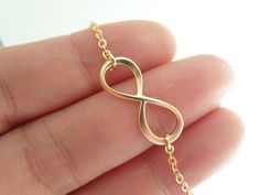 Tiny gold infinity necklace..simple by TiffanyAvenueBridal on Etsy, $16.00 Dainty Infinity Jewelry With Delicate Chain, Dainty Infinity Delicate Chain Jewelry, Minimalist Gold Infinity Necklace, Minimalist Infinity Gold Necklace, Gold Infinity Necklace For Gift, Infinity Necklace With Delicate Chain For Wedding, Simple Gold Necklace For Bridesmaid Gift, Dainty Gold Infinity Necklace, Dainty Infinity Necklace For Wedding