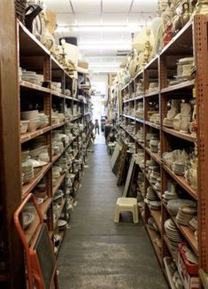 the shelves are filled with many different types of dishes