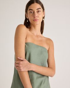 100% European linen in a flowy, relaxed fit, this strapless top is the warm-weather essential your closet has been begging for. It’s lightweight and breathable, with a timeless strapless design that works well with skirts, shorts, or matching linen pants. Our favorite detail? The smocked back that creates a comfortable yet flattering fit. Bonus: our linen is made from 100% European flax, which is more sustainable and less resource-intensive to grow  | Quince | Women's 100% European Linen Straple Casual Light Wash Strapless Top, Solid Strapless Seamless Tank Top, Cheap Green Strapless Tank Top, Elegant Strapless Cotton Top, Strapless Linen Top, Black Sand, European Linens, Linen Women, Linen Pants