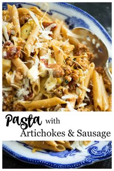 pasta with artichokes and sausage in a blue and white bowl on a table