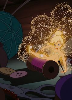 the tinkerbell fairy is sitting on top of a barrel with sparkles in it