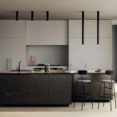 a kitchen with marble counter tops and bar stools