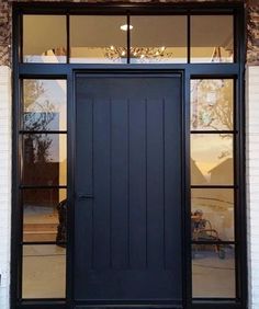 a black front door with two glass panes