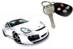 a white sports car with a key chain attached to it