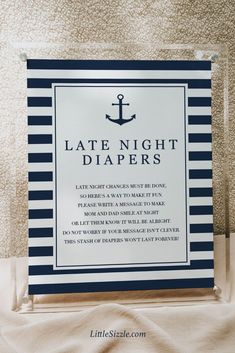 a sign that says diaper raffle with an anchor on the front and bottom