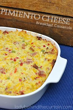 a casserole dish with ham and cheese in it on a blue place mat