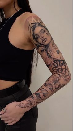 a woman with tattoos on her arm and shoulder