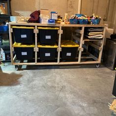 several bins are stacked on top of a workbench