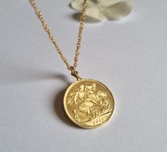 This gold coin necklace was handmade using an old gold Moroccan coin an acquainted of mine inherited from her mother.  The pendant can be used on both sides. See last photo for the back side of the coin. The necklace is a quality 14k gold filled chain. The coin pendant necklace is also available in sterling silver. Dimensions: The old Moroccan coin pendant's diameter is 2.1 cm (0.8 inches) The 14k gold necklace is available in multiple lengths.  This Gold coin necklace is delicate, unique and be Victorian Gold Jewelry With Coin Pendant, Antique Coin Necklace With Vintage Charm As Gift, Antique Coin Necklace With Vintage Charm For Gift, Antique Coin Pendant Necklace As Gift, Antique Style Coin Necklace With Vintage Charm For Gifts, Vintage Yellow Gold Brass Coin Necklace, Brass Coin Necklace Gift, Brass Coin Necklace For Gift, Vintage Charm Coin Necklace For Gift