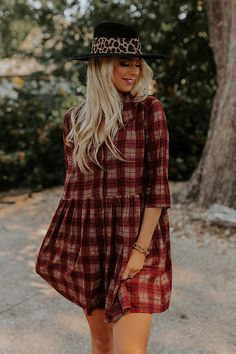 You will surely be in a cherry mood when you wear this charming tunic dress featuring lightweight material patterned with a brown and dark red hued plaid print, a v-cut neckline, loose 3/4-length sleeves, and a relaxed silhouette that falls into a straight mid-thigh length hemline! Measurements S : Bust 44", Hip 50", Length 33", Sleeve Length 15.5", Waist 44". M : Bust 46", Hip 52", Length 33.5", Sleeve Length 16", Waist 46". L : Bust 48", Hip 54", Length 34", Sleeve Length 16", Waist 48". XL : Casual Brown Plaid Dress For Fall, Long Sleeve Brown Plaid Dress For Fall, Red 3/4 Sleeve Dress For Fall, Red Half Sleeve Dress For Fall, Bohemian Burgundy Dress For Fall, Fall Plaid V-neck Dress, Bohemian Plaid Long Sleeve Dress, Casual Burgundy Dress For Fall, Plaid Bohemian Dresses For Fall