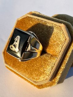 Classic vintage 1940s retro era 10k yellow gold genuine onyx letter "A" ring! This timeless statement ring has a 10k yellow gold setting, that contains a genuine onyx  gemstone. There is an old English letter "A" in the center. A fantastic piece of fine 1940s era personalized jewelry!  ERA - Circa 1940s / Retro  METAL / MATERIAL - 10k yellow gold, genuine onyx MARKINGS / HISTORY - 10k  CONDITION - Good vintage condition. Yellow gold metal has been polished & cleaned. Age appropriate patina & wea Vintage Rectangular Signet Ring With Polished Finish, Vintage 14k Gold Initial Ring For Formal Occasions, Vintage Formal 14k Gold Initial Ring, Formal Vintage 14k Gold Initial Ring, Vintage Formal Initial Ring Hallmarked, Vintage Rectangular Engraved Ring, Vintage Engraved Ring For Collectible, Vintage Personalized Engraved Ring For Collectors, Vintage Signet Ring With Initials