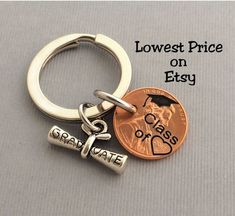 a penny and keychain with the words lowest price on etsy