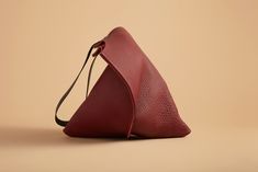 Free USA shipping. 15-30 USD international shipping. All work is made to order. Please allow 5-7 days for me to cut and sew your pieces. Thick, supple wine-colored bull leather bag. A bit pricier than the standard leathers I use and a bit more luxurious. Highest quality, US origin, full-grain leather. Modern and gorgeous. Specifications Simple unlined shoulder bag in port leather. The black leather strap is medium length and finished with double screws and an interior keyring. The suede texture Yellow Leather Bag, Minimalist Tote Bag, Modern Handbag, Custom Strap, Vintage Fine Jewelry, Simple Leather, Rug Bag, Classic Bags, Brown Leather Strap