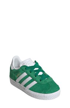 Initially designed in '91 as a training shoe for top athletes, the iconic Gazelle sneaker has been refreshed with stretchy laces for your little athlete. Pull-on style with elastic laces Leather and synthetic upper/textile lining/rubber sole Imported Adidas Kids, Elastic Laces, Training Shoes, Rubber Sole, Nordstrom, White Gold, Adidas, Elastic, Sneakers