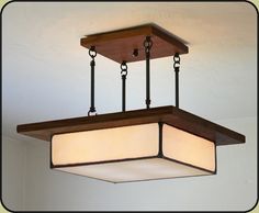 a square light fixture hanging from the ceiling