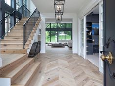 the interior of a house with wood floors and white walls is featured on instagram