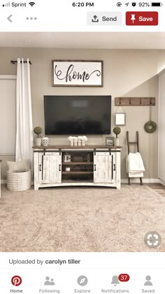 a tv sitting on top of a wooden stand in a living room