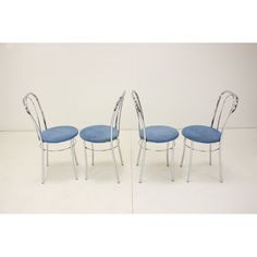 three chairs with blue upholstered seats are shown in the same image as each other