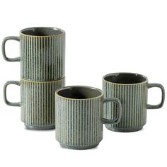 three coffee mugs sitting next to each other