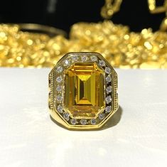 Vintage 15K Gold Citrine & White Topaz Ring ...Marked 610 and tested 15K Gold...Total of weights 5.6grams...Size 8.5...Measure of Face 21MM...It's in very good condition. Gold Octagon Jewelry With Halo Setting, Gia Certified Gold Topaz Ring, Yellow Gold Octagon Topaz Ring For Anniversary, Gold Emerald Cut Topaz Ring With Vvs Clarity, Gold Citrine Ring With Halo Setting, Gold Citrine Rings With Halo Setting, Gold Octagon Diamond Ring With Center Stone, Gold Emerald-cut Topaz Ring With Accent Stones, Gold Emerald Cut Topaz Ring With Accent Stones