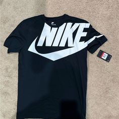 Black Nike T Shirt With Lettering. Shirt Is Brand New Never Been Worn. Fits Close To Size And Nice Material With Big Lettering Shirts Nike, Nike T, Nike Tshirt, Black Nike, Nike Shirts, Nike Black, Black T Shirt, Men's Nike, Shirt Color