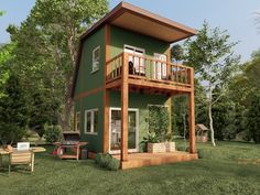 a small green house sitting on top of a lush green field