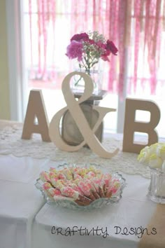 the table is decorated with pink and white flowers