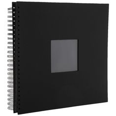 a black notebook with a square photo on the front and bottom cover that is blank