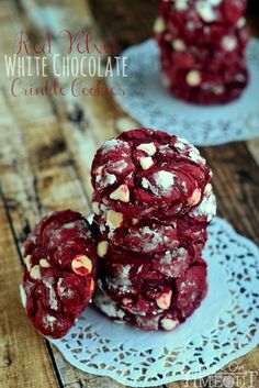 red velvet white chocolate crinkle cookies stacked on top of each other