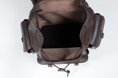 "This big dark brown leather backpack completely handmade and originally designed by ZUKA STRAPS. Handcrafted from full-grain leather that has a gorgeous, well-traveled vintage aesthetic and comfortably accommodates everything from clothes, laptops and documents to some essentials for the weekend or the gym. DETAILS - 30 liters capacity - Handcrafted with full-grain leather - 3 outer pockets - hardened bottom - 2 adjustable padded shoulder straps - Secure antique brass closures - Exterior dimens Brown Leather Backpack With Leather Lining For Outdoor, Brown Leather-lined Backpack For Everyday Carry, Outdoor Brown Backpack With Leather Lining, Brown Backpack With Leather Handles For Everyday Carry, Brown Travel Backpack With Smooth Grain, Adventure Brown Leather Backpack, Brown Leather-backed Adventure Backpack, Travel Backpack With Smooth Grain In Brown, Brown Smooth Grain Travel Backpack