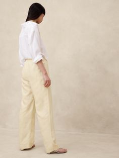 Easy and lightweight, this relaxed pant balances sharp tailoring with the lived-in look of linen.  We crafted this pair in a beautiful Italian fabric that blends luxurious linen with soft, silky  TENCEL™ lyocell.  Plus, we hid a bit of elastic at the back waistband for a custom fit.  Mid rise (9. 75"), wide leg.  Full length.  Fabric from Italy's Olimpias mill.  Sustainability: Made with TENCEL™ lyocell, a sustainably sourced fiber from responsibly-harvested trees.  Zip fly with hook-and-bar closure.  No pockets.  Unlined.  Mid rise (9. 75") with a straight leg.  Full length.  Inseams: Petite/Short 29. 5", Regular 31. 5", Long/Tall 34. 5" Model: Size S, 5'10" (178cm). Relaxed Trousers, Petite Shorts, Luxury Linen, Italian Fabric, The Gap, Petite Size, Custom Fit, Banana Republic, Mid Rise