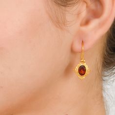 Garnet Vermeil 14K Gold Over Sterling Silver Earring 925 Silver = 2.35 gm. Garnet = 2.40 ct. Garnet is the birthstone for January and is a symbol of friendship. The beautiful earring measures to be 1.00 inches long including the wire and 0.50 inches wide at its maximum points. The earrings have been made by a team of highly trained and skilled artisans. What is Vermeil 14K Gold? It is a thick layer of 14K Gold plating on 925 Sterling Silver. If for any reason you are not completely satisfied, yo Classic Birthstone Drop Earrings, Amber Gemstone Earrings For Anniversary, Classic Birthstone Earrings For Formal Occasions, Oval Birthstone Earrings For Formal Occasions, Gold Oval Birthstone Earrings, Oval Gold Birthstone Earrings, Heirloom Sterling Silver Earrings For Gift, Classic Gemstone Earrings As Gift, Classic Gemstone Earrings Perfect As Gifts