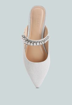 The slip on mules look like a dream with beautiful pearl embedded details. The minimalist embellishment makes these mules simply alluring and would pair beautifully as mother of the bride shoes or comfortable bridal shoes with their easy to wear and soft padded insoles. Type: Mule Heel Type: Flat Mules Closed Pointed Toe Slip On Upper Material: Shimmer Textile Lining: Super Soft Lining Leatherette Out Sole: Rubber Pearl embellishment Cushioned Insole Party Wear Dress Sandals RCSH3111 Pointed Mules, Comfortable Bridal Shoes, Casual Pumps, Plus Size Mini Dresses, Plus Size One Piece, Flat Mules, Slip On Mules, Foot Jewelry, Bride Shoes