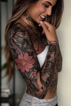 a woman with tattoos on her arms and chest