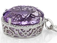 21.95ct Oval Lavender Amethyst and .17ctw round white Topaz Rhodium Over sterling Silver Halo pendant With 18" singapore Chain. Measures approximately 1.12"L x .71"W. Lobster clasp. 2.5mm bail. Finished Back. Purple Oval Jewelry With Diamond Accents, Oval Amethyst Jewelry With Diamond Accents, Formal Oval Necklace With Accent Stones, Luxury Oval Amethyst Jewelry, Purple Oval Diamond Cut Jewelry, Oval Purple Diamond Cut Jewelry, Elegant Oval Amethyst Pendant Jewelry, Purple Jewelry With Diamond Accents, Purple Round Pendant Jewelry For Formal Occasions