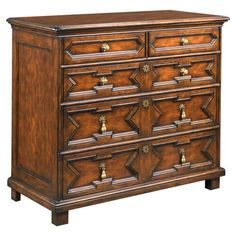 a wooden dresser with many drawers and knobs