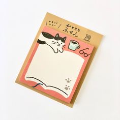 a card with an image of a cat holding a coffee cup on it's back