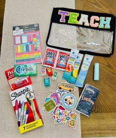 an assortment of school supplies on a table