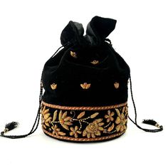 "Look your best wearing this luxurious black velvet bucket bag potli bag, exquisitely embroidered with glittery metallic copper flowers and embellished with genuine semi precious stones. It is certain to bring you compliments. Perfect for Indian wedding or for going on the town! Expertly hand embroidered by third generation master zardozi artisans. Of exceptional quality. - 9\" x 6\", useable interior space 6\" x 6 \". - Rigid bottom and 2\" base, so bag sits nicely. - Wrist cord with tassel, 6 Elegant Black Bucket Bag For Gift, Black Bags For Festivals And Gifts, Elegant Gold Embroidery Pouch For Festivals, Evening Potli Bag With Gold Embroidery For Festivals, Luxury Handmade Potli Bag For Formal Occasions, Evening Bags With Zari Work For Festivals, Bohemian Bags For Festive Formal Occasions, Traditional Velvet Bags For Formal Occasions, Festive Black Bag For Festivals