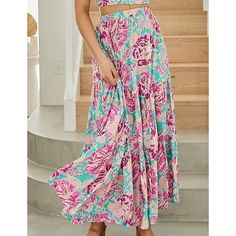 Fuchsia Floral Print Pocketed Maxi Skirt Flared Pink Maxi Skirt With Floral Print, Pink Flared Maxi Skirt With Floral Print, Pink Floral Print Maxi Skirt For Vacation, Pink Floral Print Flowy Maxi Skirt, Pink Tiered Maxi Skirt For Beach, Pink Beach Skirt With Elastic Waistband, Pink Tiered Skirt For Vacation, Pink Relaxed Maxi Skirt For Beach, Pink Floral Print Long Skirt