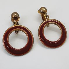 Vintage red, dangle hoops. Red is an enamel like material within gold tone metal. Hardware is gold tone as well. Earrings are in good vintage condition considering age with a little tarnish but it looks good with overall look of earrings. Earrings are mid sized. Hardware works properly. Please refer to all photos for more details.  Shipping is included. Gold Tone Metal, Cute Jewelry, Clip On Earrings, Gold Tones, Jewelry Earrings, Red, Gold