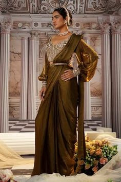 Copper pre-draped saree. Paired with a corset style blouse with sequins, beads, crystal embroidery and matching belt. - Aza Fashions Silk Draped Sets For Diwali, Diwali Draped Silk Sets, Pre-draped Silk Sets, Diwali Silk Draped Sets, Draped Blouse Piece For Eid Reception, Elegant Draped Designer Dresses, Formal Pre-draped Draped Blouse, Formal Saree With Draped Sleeves And Traditional Drape, Designer Pre-draped Fitted Saree