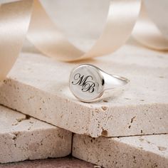 A personalised solid silver engraved initial ring makes a timeless essential piece of jewellery to treasure. A unique custom engraved solid silver signet ring that's perfect for a landmark birthday, such as 18th or 21st birthday gift for a son or grandson. The silver ring is solid silver, the back is not hollow, it's solid throughout, and hallmarked in the UK for your assurance of quality.  Initials are laid out in gently overlapping script fonts. CHOOSE YOUR FINISH Choose to have your signet ri Silver Monogram Ring For Wedding, Silver Monogram Engraved Ring For Wedding, Sterling Silver Initials Ring For Anniversary, Timeless Initial Ring In Sterling Silver As A Gift, Sterling Silver Initial Ring For Gift, Timeless Sterling Silver Initial Ring As Gift, Timeless Sterling Silver Jewelry With Initials, Timeless Personalized Initial Ring For Anniversary, Silver Monogram Ring Jewelry