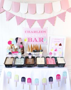 an ice cream bar is set up on a table