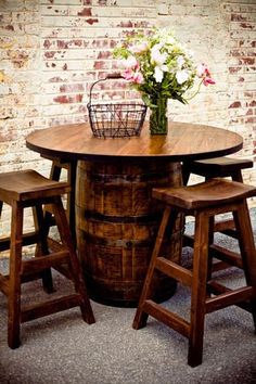 an image of a table and stools on pinterest